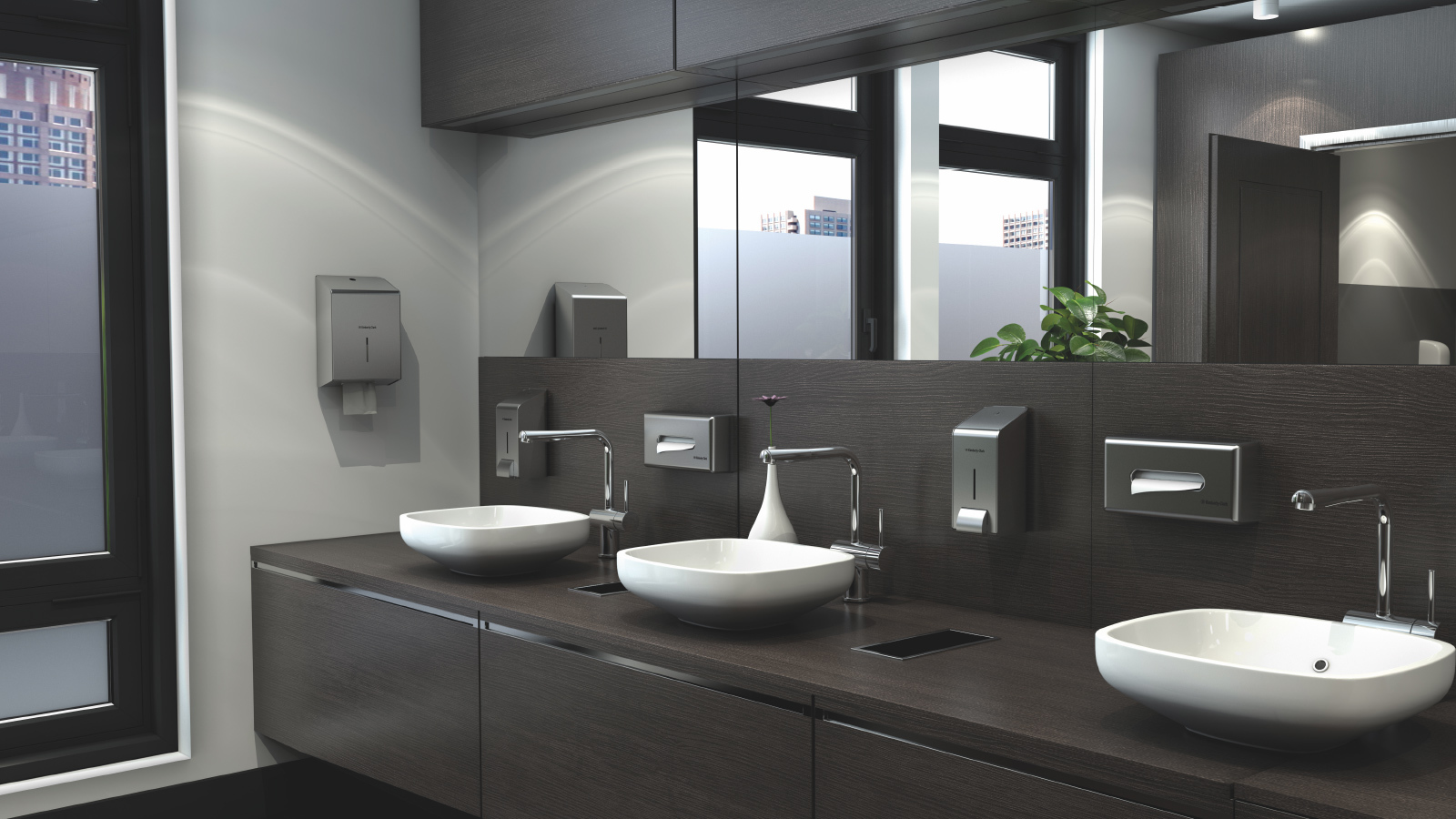 Stainless steel paper towel, facial tissue and soap dispensers in upscale office restroom