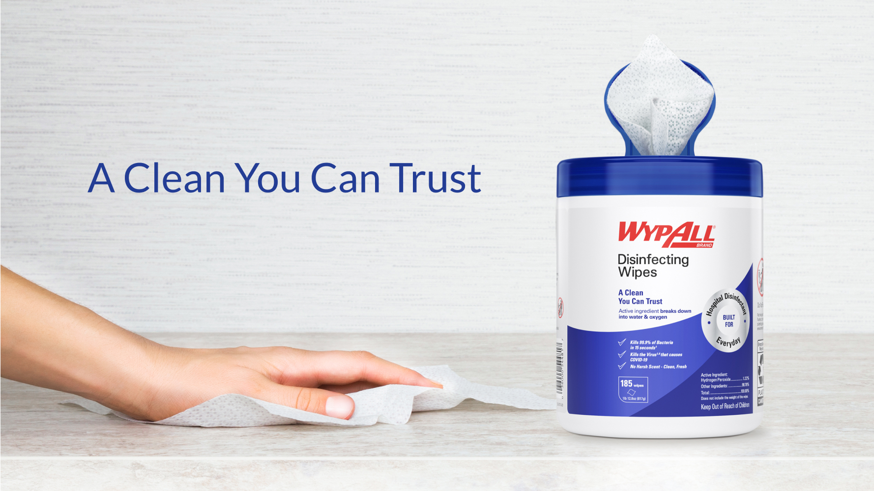 WypAll® Disinfectant Wipes container and hand wiping a surface