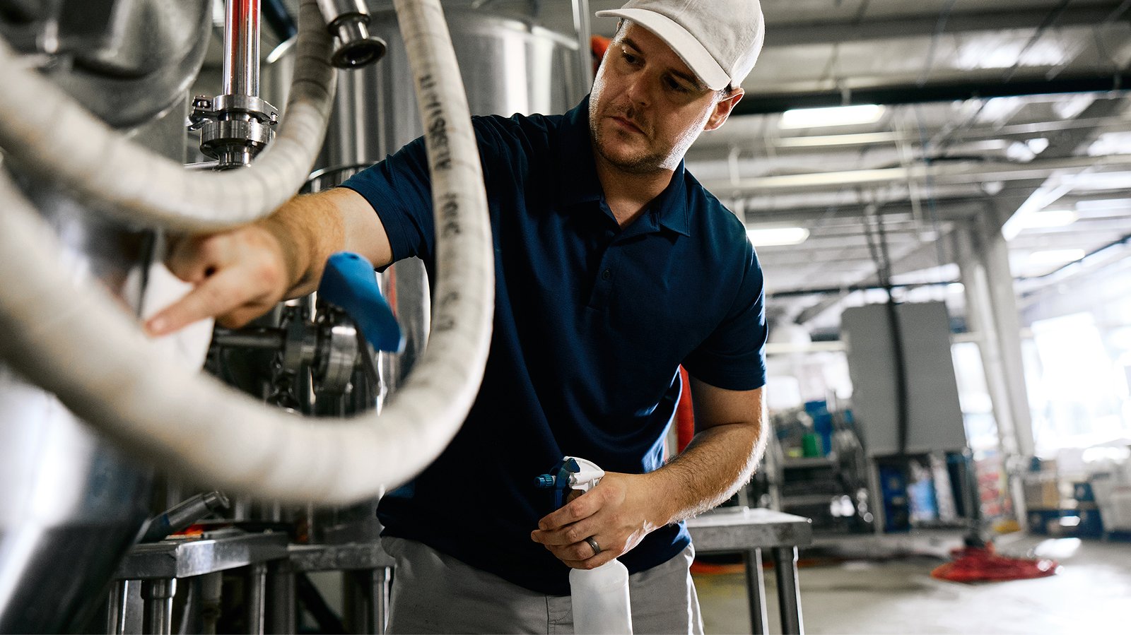 Workers cleaning an industrial facility to enhance productivity and safety